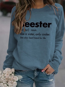 Close-up of blue crewneck sweatshirt featuring a creative seester definition print