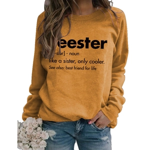 Close-up of orange long sleeve crewneck sweatshirt with black Seester text print