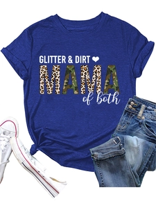 Detail view of GLITTER & DIRT MAMA text with leopard and camo print on a blue cotton T-shirt