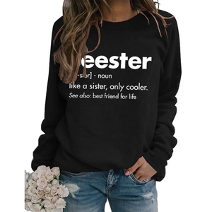 Detail of loose black crewneck sweatshirt featuring white Seester dictionary definition print