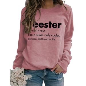 Detailed view of pink crewneck sweatshirt featuring black seester letter print design