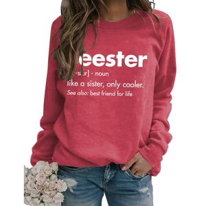 Detailed close-up of dark red crew neck sweatshirt featuring white letter print design