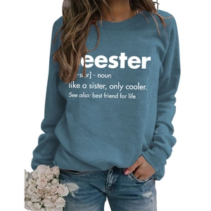 Close-up of blue crewneck sweatshirt featuring white Seester creative text print