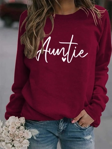 Detail of burgundy crewneck sweatshirt with white Auntie script and heart print