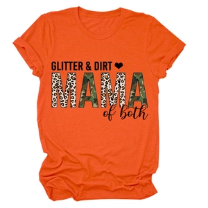 Close-up of GLITTER & DIRT MAMA of both leopard print and camo text on orange t-shirt