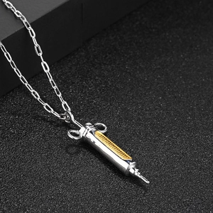Hip hop syringe pendant necklace in silver and gold tones on paper clip chain