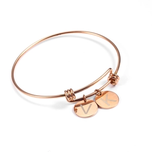 Adjustable rose gold titanium bracelet with circular V and K letter pendants