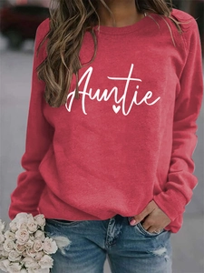 Close-up of the Auntie script print and heart detail on a red long sleeve sweatshirt