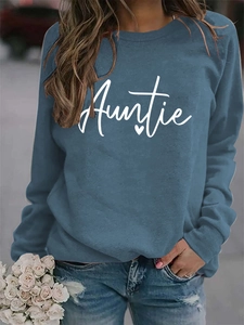 Detail of navy blue sweatshirt with white Auntie lettering and heart print on chest
