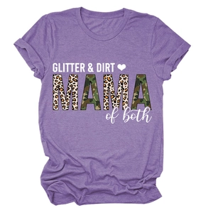 Close-up of GLITTER & DIRT MAMA print with leopard and camo textures on purple t-shirt