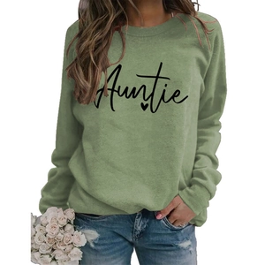 Detail of light green sweatshirt with black Auntie print and heart, soft knit fabric