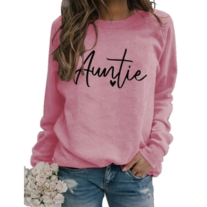 Detail of pink long sleeve sweatshirt featuring black Auntie script print and heart