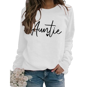 Detail of white crewneck sweatshirt featuring Auntie print and small heart design