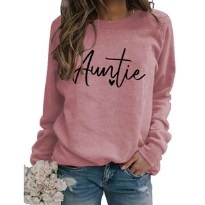 Detailed view of pink long sleeve sweatshirt with Auntie print and heart graphic design