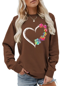 Detail of coffee brown sweatshirt with rainbow tie-dye paw prints and heart design