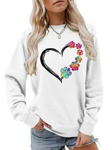Close-up of the rainbow gradient paw print and heart outline on a white sweatshirt