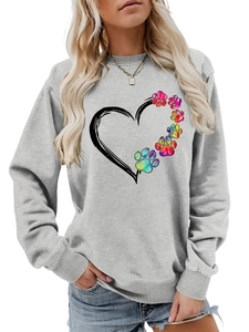 Detail of grey sweatshirt showing rainbow gradient paw prints and heart outline