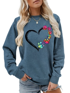 Detail of greyish-blue sweatshirt featuring a rainbow paw print and heart design