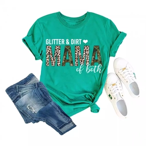 Flat lay of a green T-shirt with GLITTER & DIRT print, jeans and white canvas shoes