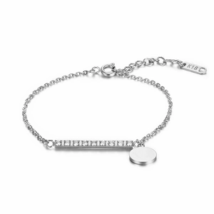 Polished silver K18 titanium bracelet with a sparkling diamond bar and a round charm disc
