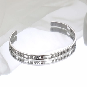 Polished silver C-shaped cuff bracelet with LET'S GO TRAVEL AROUND THE WORLD cutout text