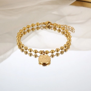 Bracciale a sfere dorate con ciondolo Fu e catena regolabile su seta bianca