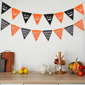 Detail of Happy Halloween bunting flags with pumpkin faces in a party home setting