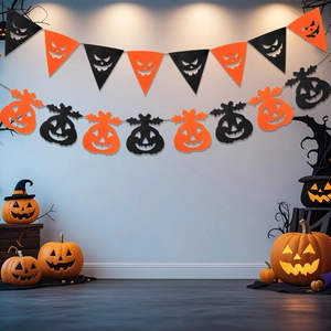 Close-up of Halloween orange and black pennant banner and spooky hanging ornaments decoration