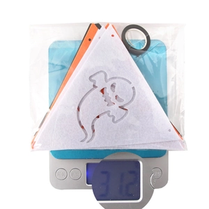 Detailed view of Halloween ghost bunting on digital scale showing a weight of 31.2g
