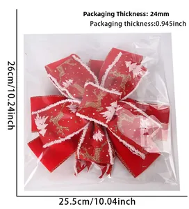 Close-up of a festive red satin Christmas bow with reindeer print and white faux fur trim