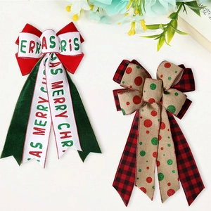 Detail of festive Christmas bows featuring red green ribbon with Merry Christmas text