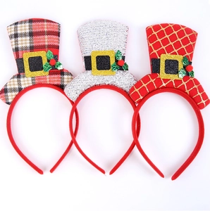 Three festive Christmas mini top hat headbands featuring glitter and plaid patterns
