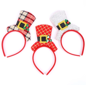 Detailed view of three Christmas headbands with glitter hats and plaid fabric textures