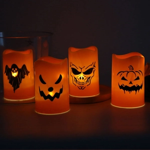 Macro detail of Halloween LED candles featuring ghost, skull and pumpkin patterns