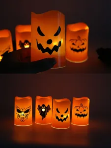 Detail view of four Halloween LED candle lights with skull, ghost and pumpkin patterns