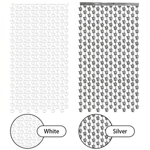 Macro detail of white and silver foil Halloween ghost fringe curtains for party background