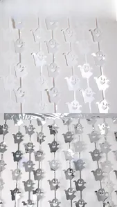Close-up of white and silver ghost-shaped tinsel curtains for Halloween party decor