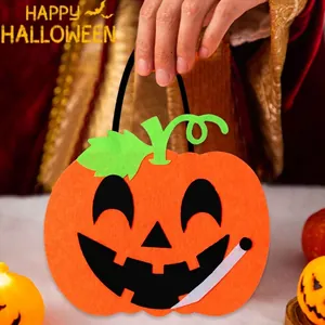 Halloween felt pumpkin candy bag with black smiling face and green leaf decoration