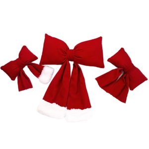 Three-piece red velvet Christmas bow set with white faux fur trim on a white background