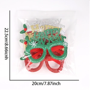 Close-up of Happy New Year glitter glasses in packaging showing 22.5cm size detail