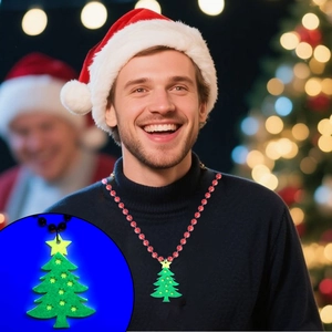 Detail showing glowing green Christmas tree pendant and red beaded necklace accessory