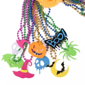 Colorful Halloween beaded necklaces with festive felt charms like pumpkin and ghost