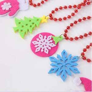 Detail of colorful felt Christmas charms on a red bead necklace for holiday parties