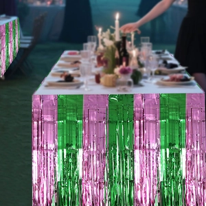 Detail of pink and green tinsel table fringe with metallic foil texture for party decor