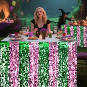 Close-up of pink and green metallic fringe table skirt for themed party decorations