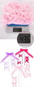 Detailed macro view of assorted colorful satin bow decorations on a digital scale for weight