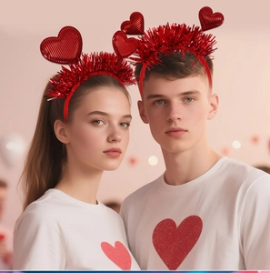 Close-up of a festive red heart headband with sparkling tinsel for Valentine party