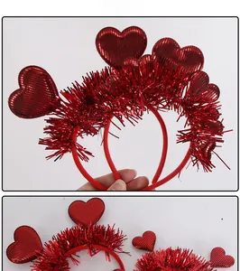 Macro detail of red tinsel headband featuring shiny heart accents for Valentine party