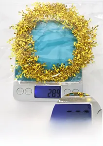 Christmas star tinsel garland weight display on scale showing 28.9g mass for party decor