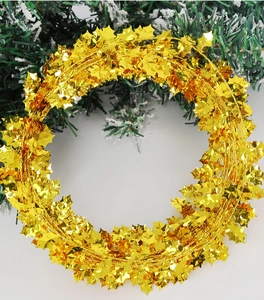 Close-up of 7.5m gold star tinsel garland for Christmas party and festive holiday decoration
